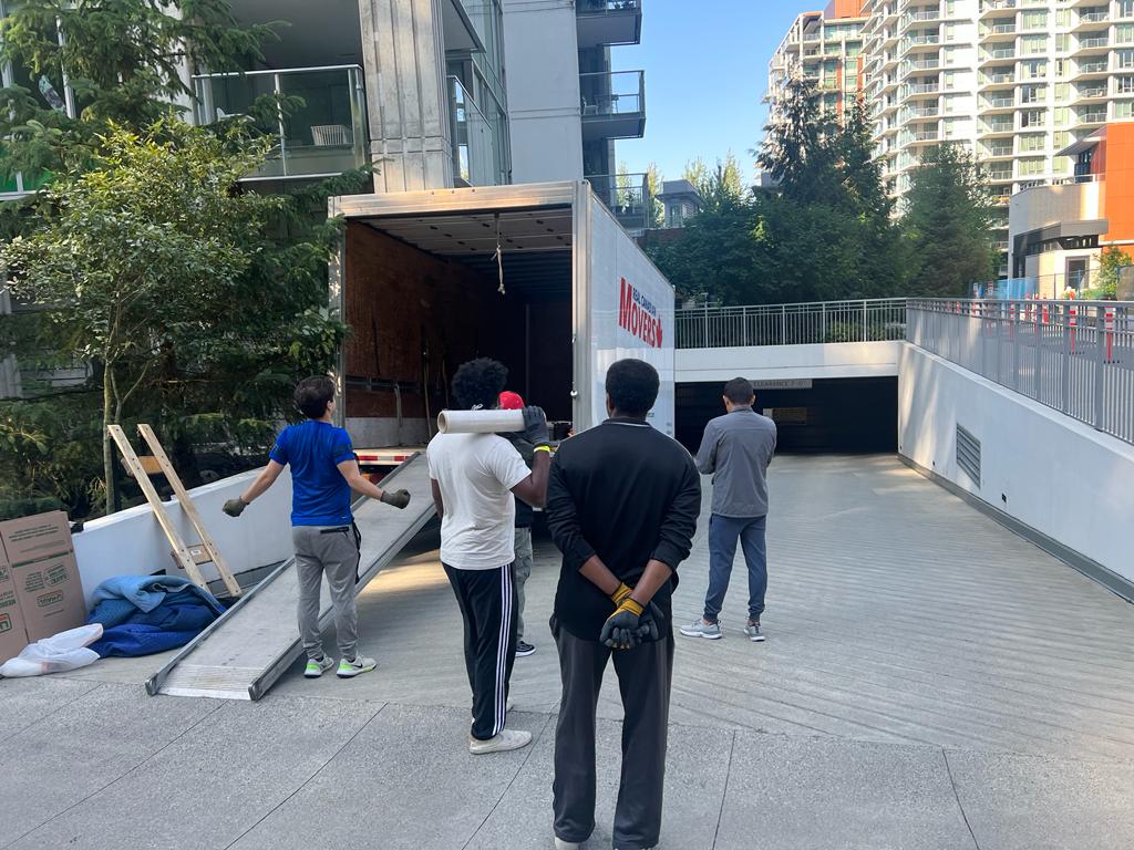 Professional Movers Loading Furniture into Truck-Real Canadian Movers